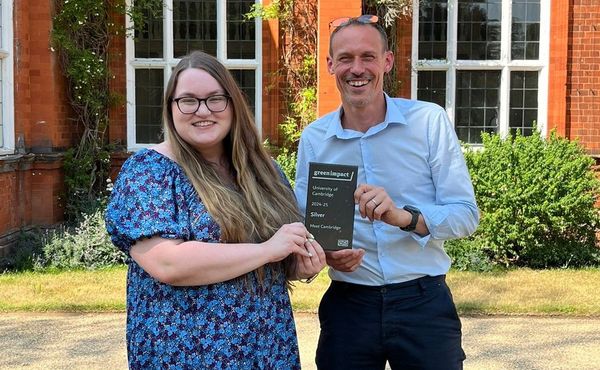 Meet Cambridge’s sustainability lead, Sarah Maycock (left) and Andrew Bell, Head of Meet Cambridge (right) collect the Green Impact Award